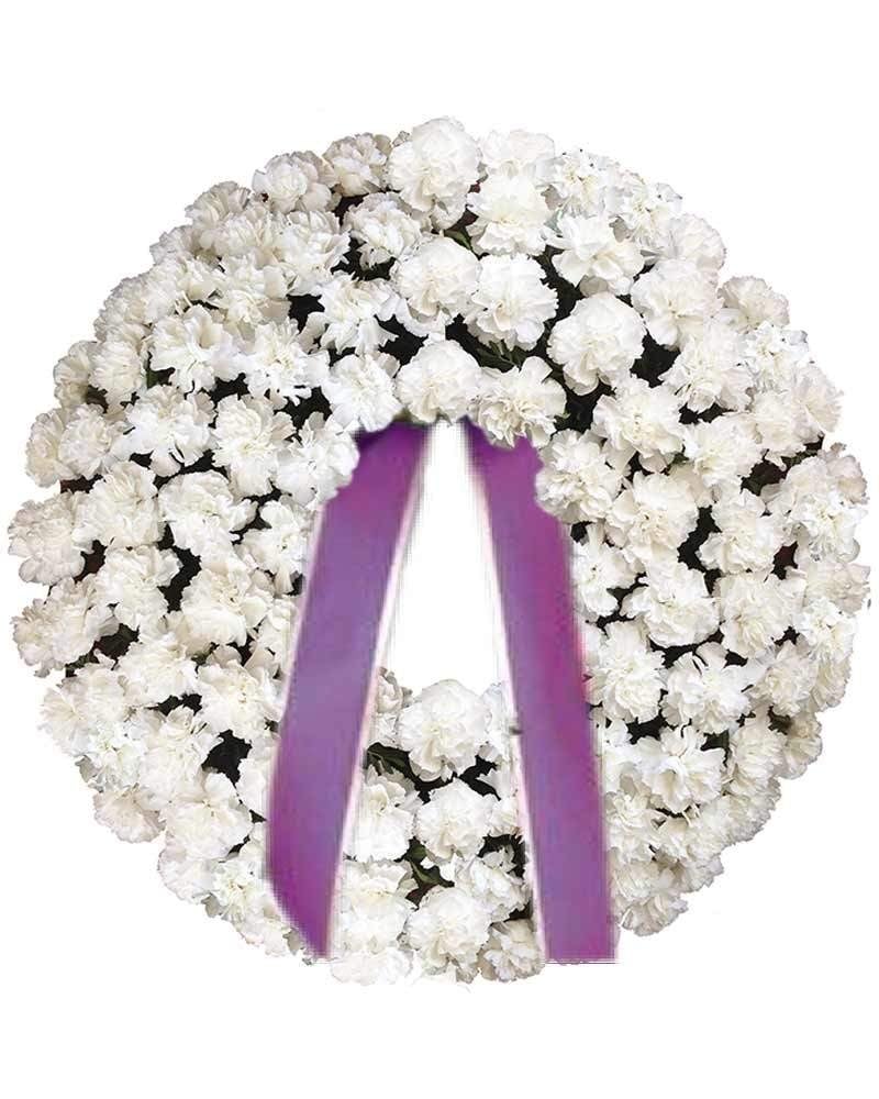 Corona de claveles blancos para difuntos.