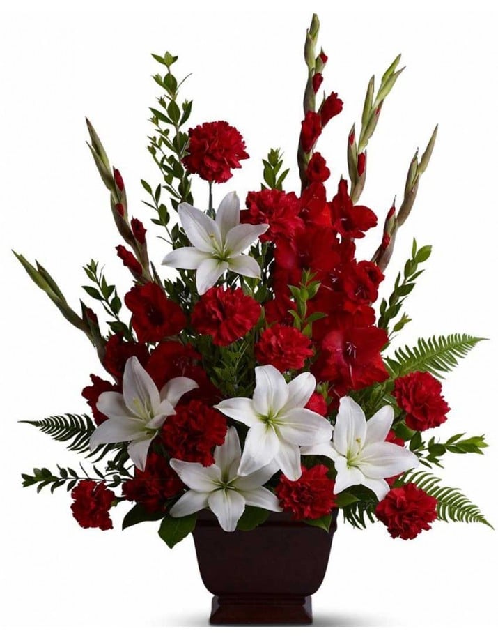 Centro de claveles y gladiolos para funerales en Madrid.