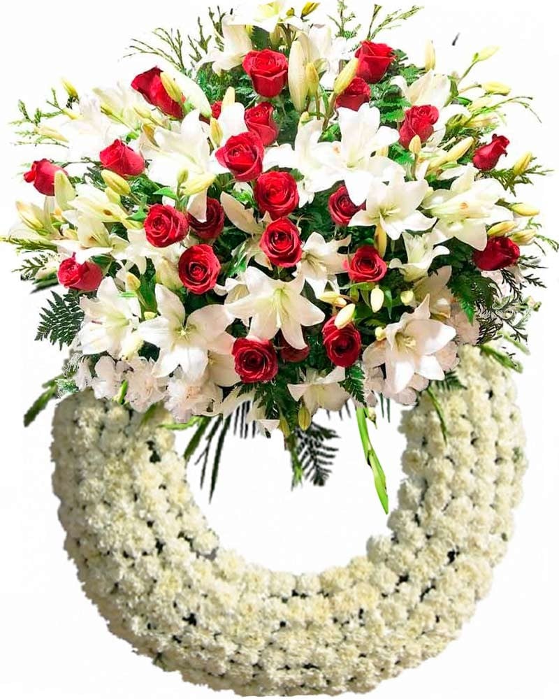 Corona de claveles, lirios y rosas rojas.