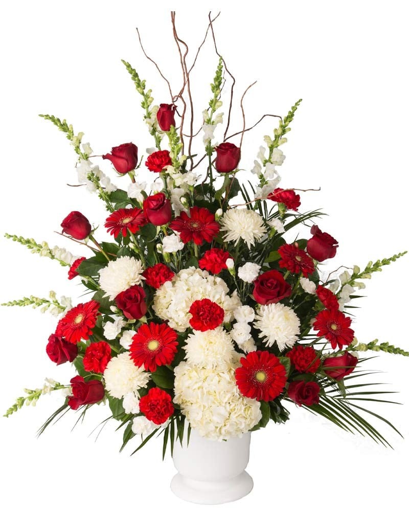 Centro de flores blanco y rojo para funerales en Madrid.